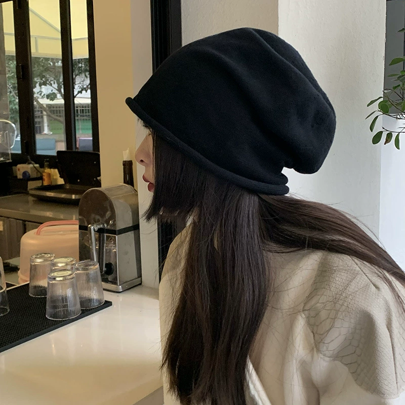 Winter knitted woolen capacious hat with hood, cut