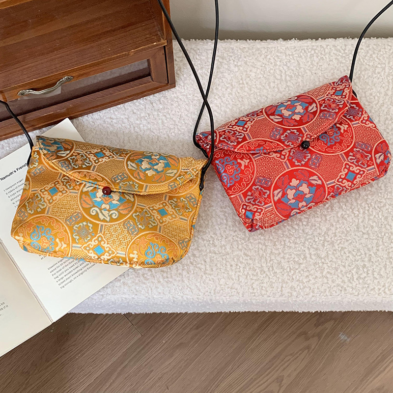 Bolso de mujer alta sensación 2025 nuevo estilo nacional bordado bolso de almacenamiento flor triturada bolsa maquillaje bolso de hombro