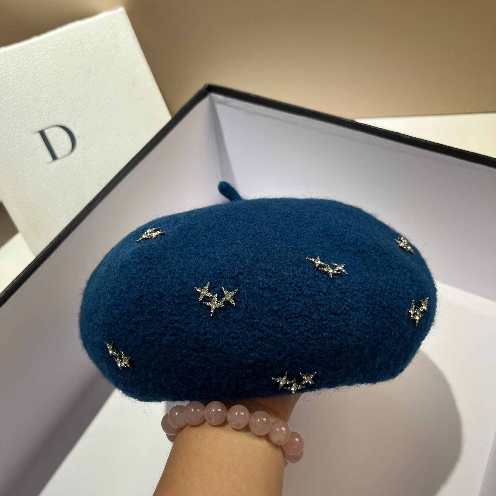 韓国版の満天の星の水は羊の小毛のベレー帽の女性の日系の甘いカボチャの帽子の秋冬のウールの画家の帽子を輝かせます。