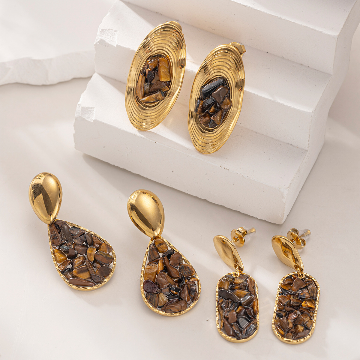 Taina europa y americana pendientes de acero inoxidable lujo ligero de alto nivel sensación de piedra triturada natural pendientes al por mayor joyería transfronteriza nicho