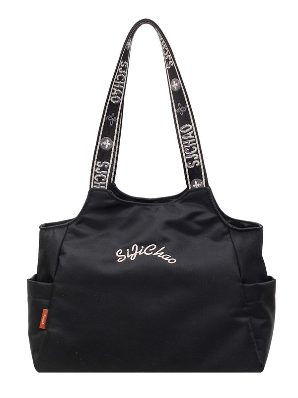 Bolsas de lona de moda de gran capacidad para mujeres 2026 nueva textura bordada letras bolsas de hombro de viaje simple bolsas de mano