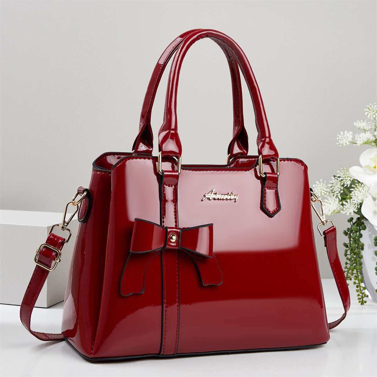 Bolso de mano de arco de piel brillante, bolso de hombro casual de moda, bolso de madre, temperamento, bolso de mochila transfronterizo