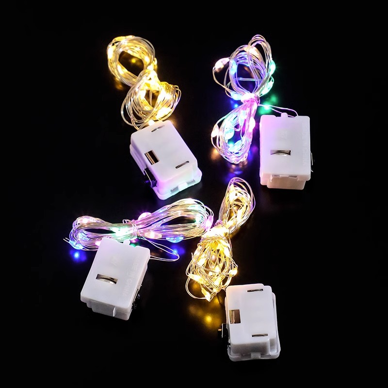 LED botón batería pequeña caja blanca flores de colores luces de cadena al por mayor árbol de Navidad decoración de alambre de cobre atmósfera luces de cadena