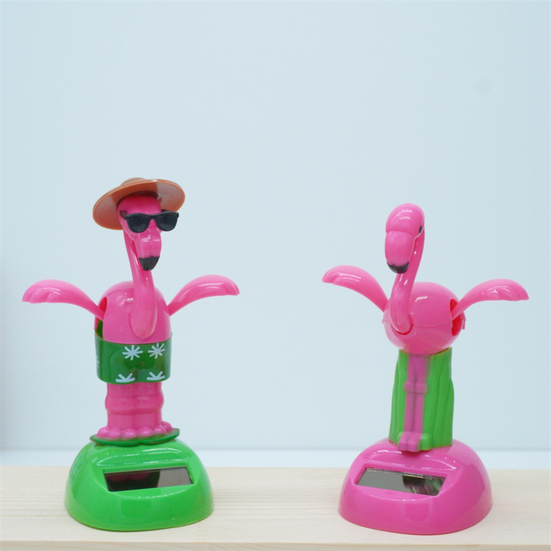 Venta caliente transfronteriza muebles oficina creativa flamenco balanceo animal sacudiendo la cabeza muñeca decoración de coche regalo de dibujos animados