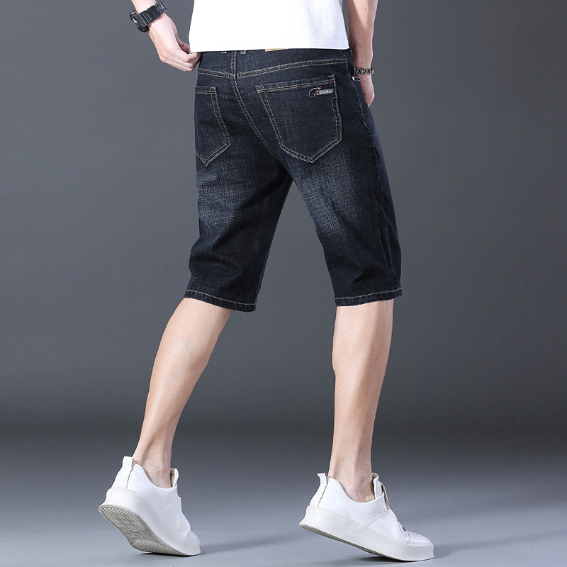 夏の薄いタイプの7分のズボンの男性のまっすぐな筒の紳士服のデニムのショートパンツの弾力性は夏の青年の中でズボンを修理します。|undefined