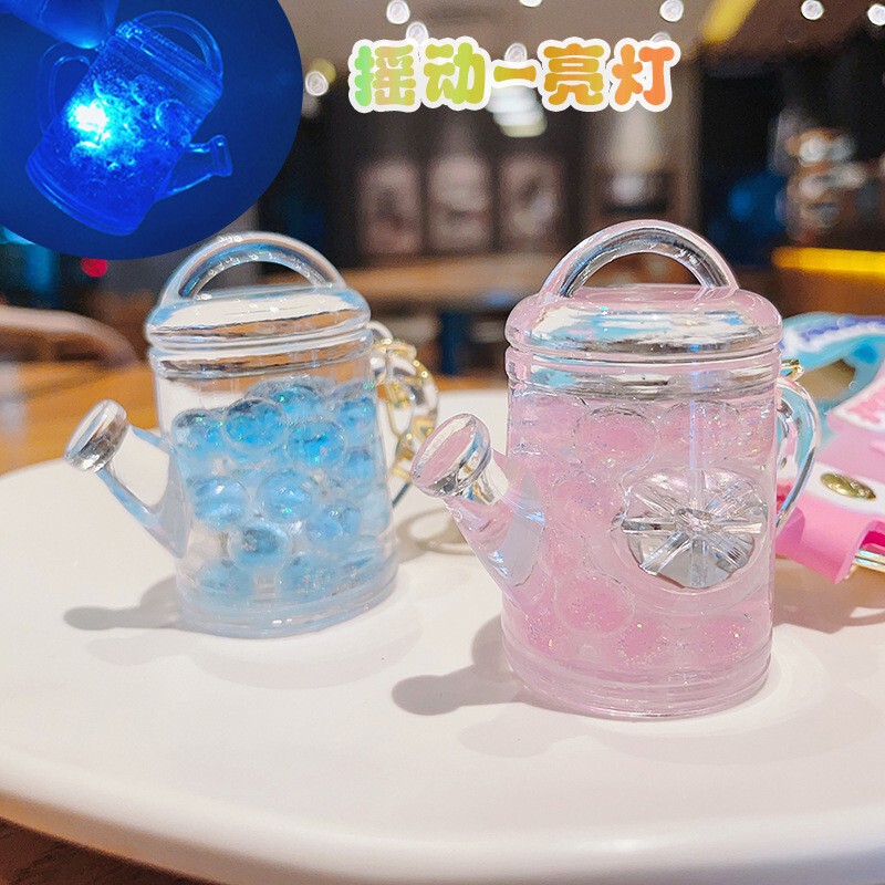 Creative watering can quicksand bottle keychain cute luminous pendant key chain hanging ornament grab machine small gift wholesale