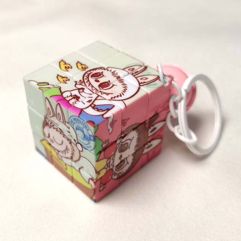 卵の子のパーティーの新型のミニの小さいルービックキューブのキーホルダーは義烏工場のメーカーの卸売りの子供機の子供を掛けます。