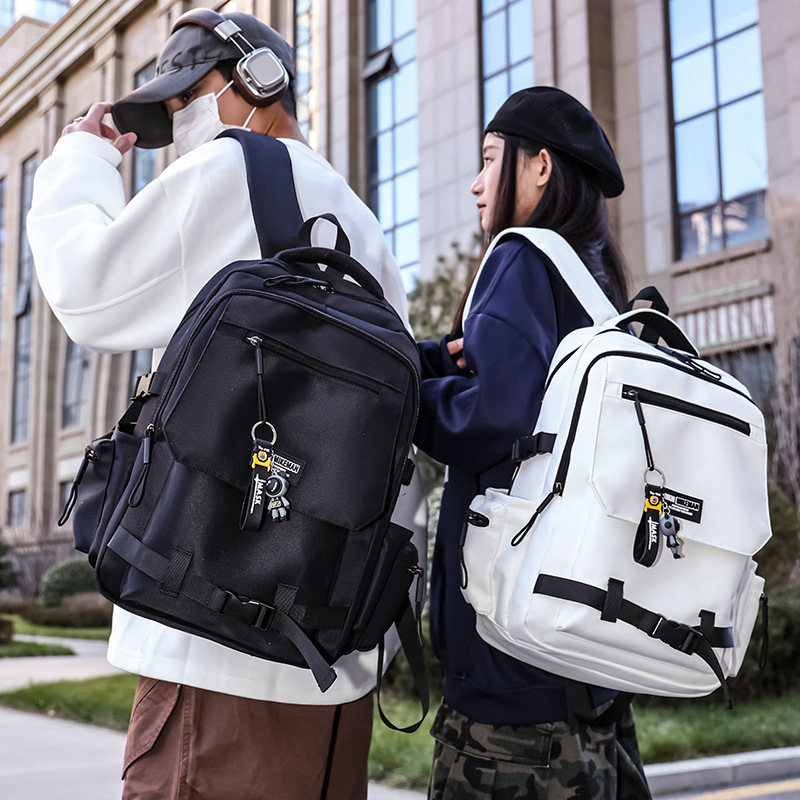 La nueva mochila de la marca de moda para hombres y mujeres de gran capacidad mochila de viaje ligera al aire libre para estudiantes de secundaria y secundaria.