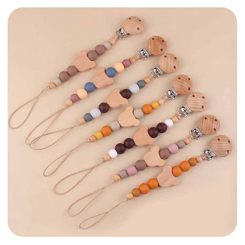 Productos para bebés y niños abrazadera de chupeta creativa caricatura bebé oso cabeza de beech mordida cadena de chupeta de dientes molares anti-caída cadena