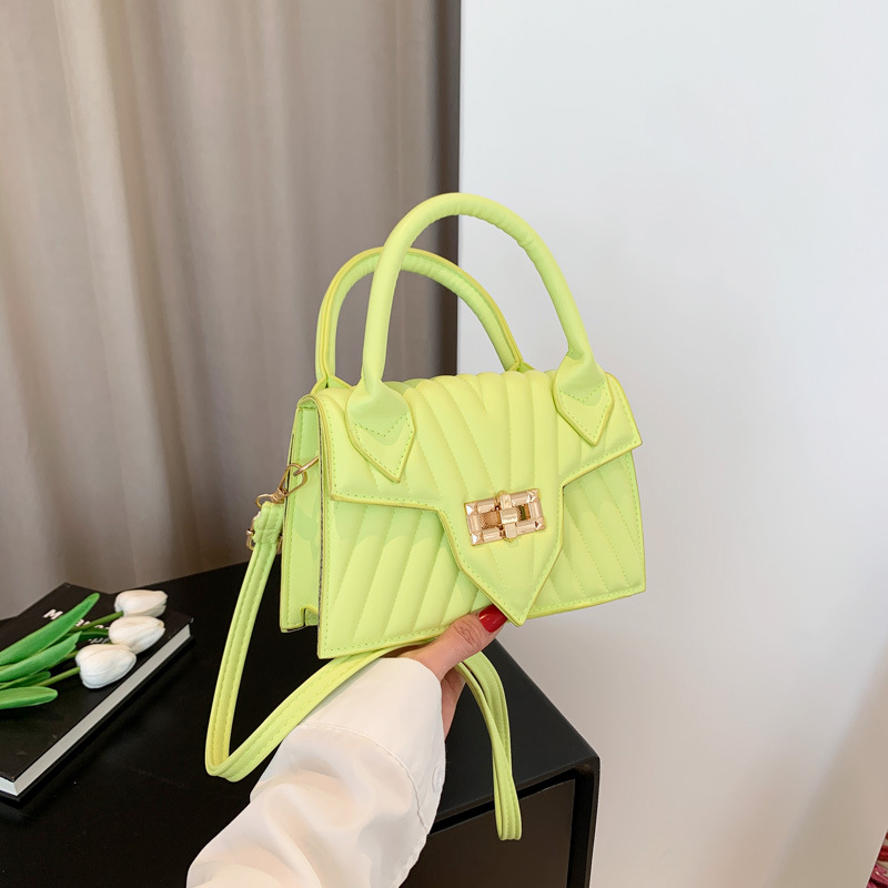 Textura 2025 nueva moda de impresión de estilo extranjero rotary-lock mochila de hombro casual color caramelo bolso de mano de mujer