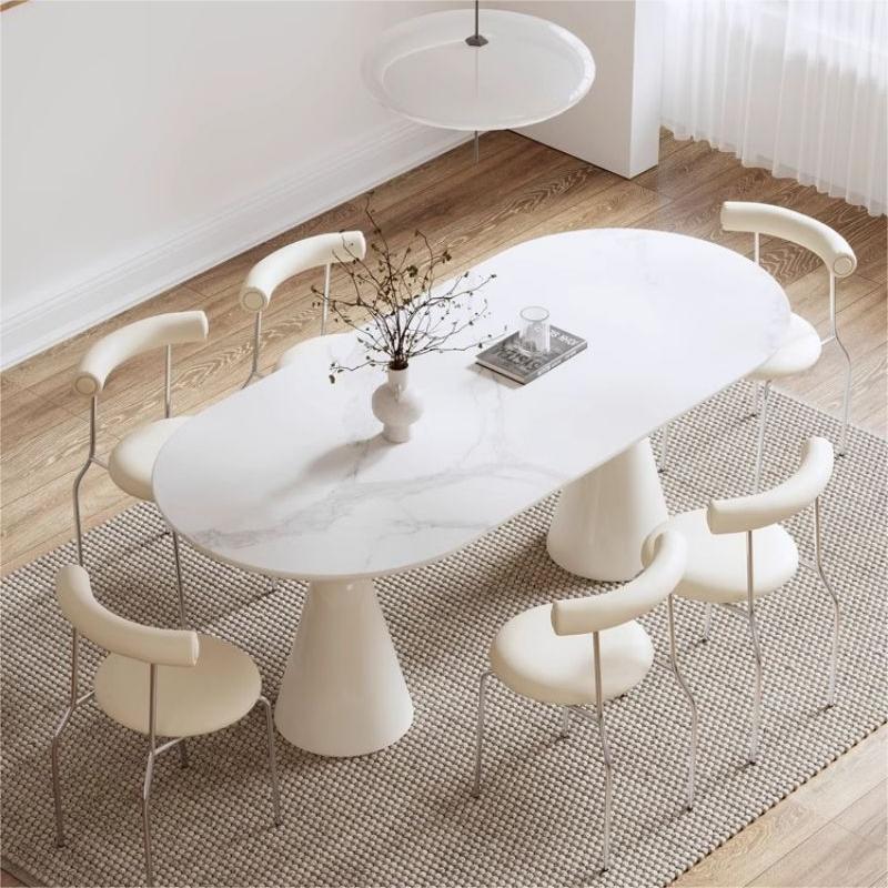 Mesa de comedor de tabla de roca ovalada de estilo de crema de estilo medieval para casa pequeña combinación de mesa de comedor de estilo francés de lujo ligero