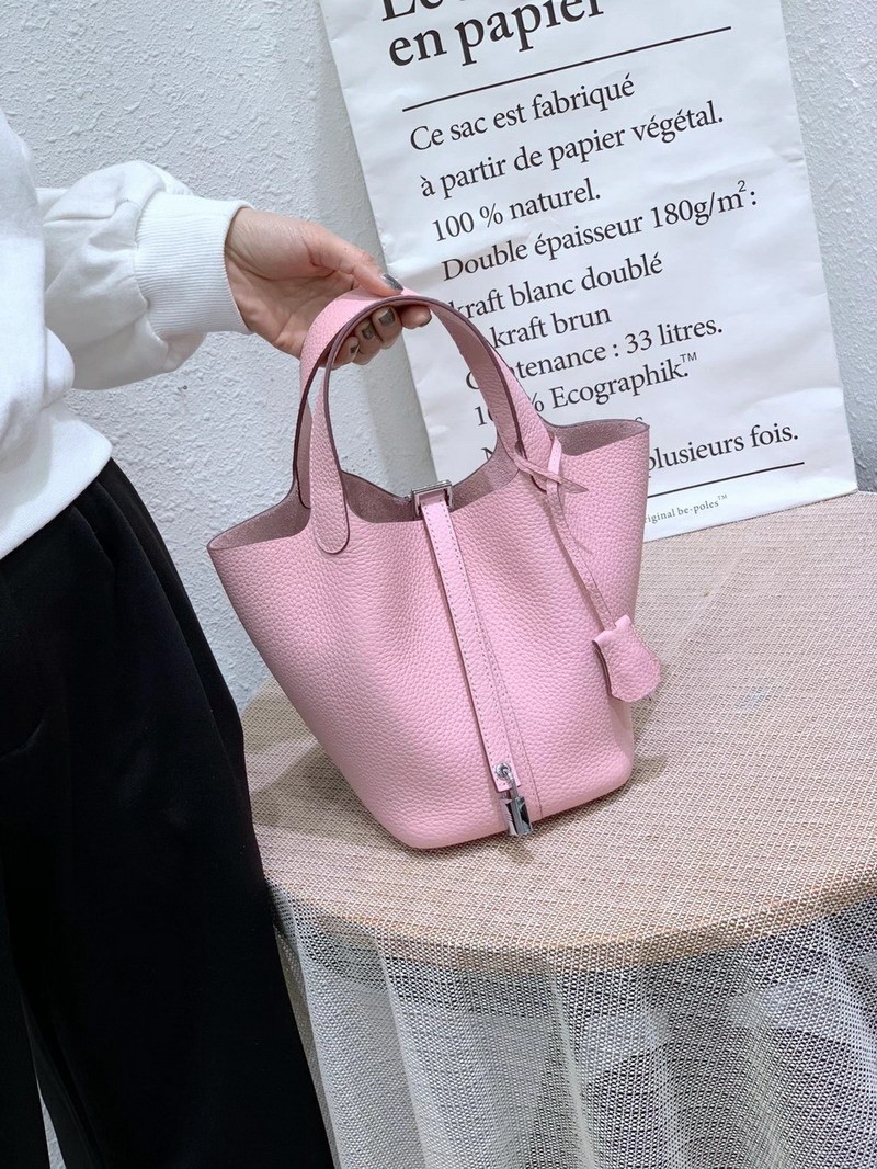 El nuevo bolso de cesta de verduras de marea de cuero togo de piel de vaca de capa superior 2025, bolso de cubo con cerradura de mano, bolso de cuero para mujer