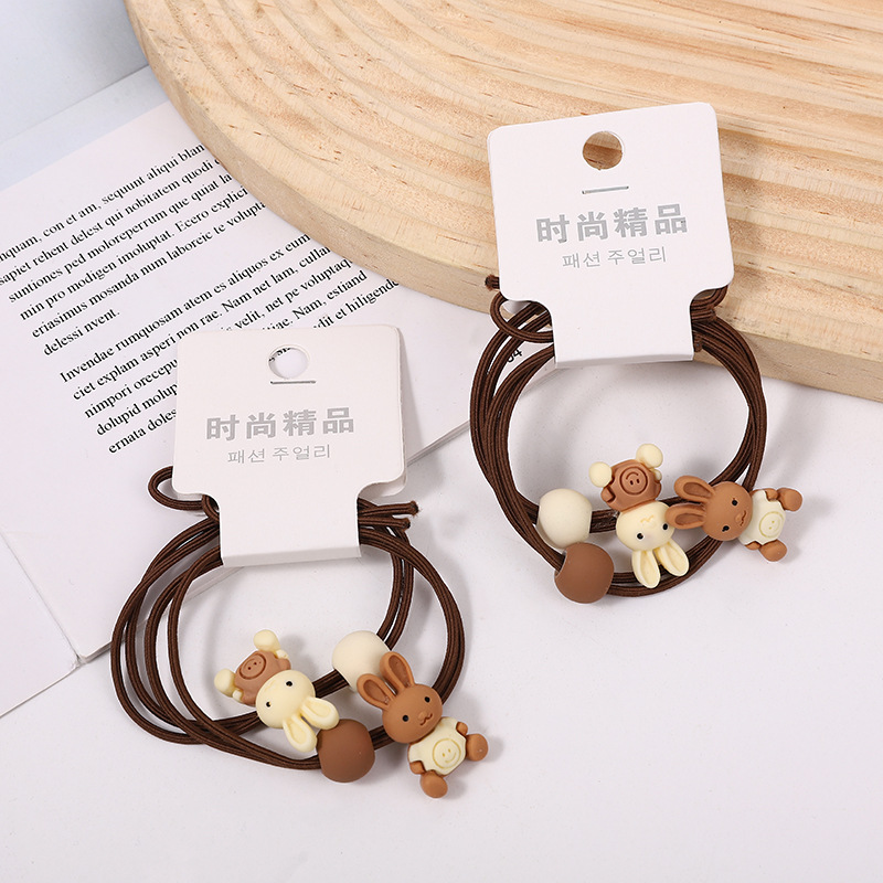 009 Ventas Directas Tarjeta de orden camuflaje A cuadros intestino grueso banda de pelo cuerda de pelo banda de goma tienda física dos yuanes tienda accesorios para el cabello accesorios para la cabeza