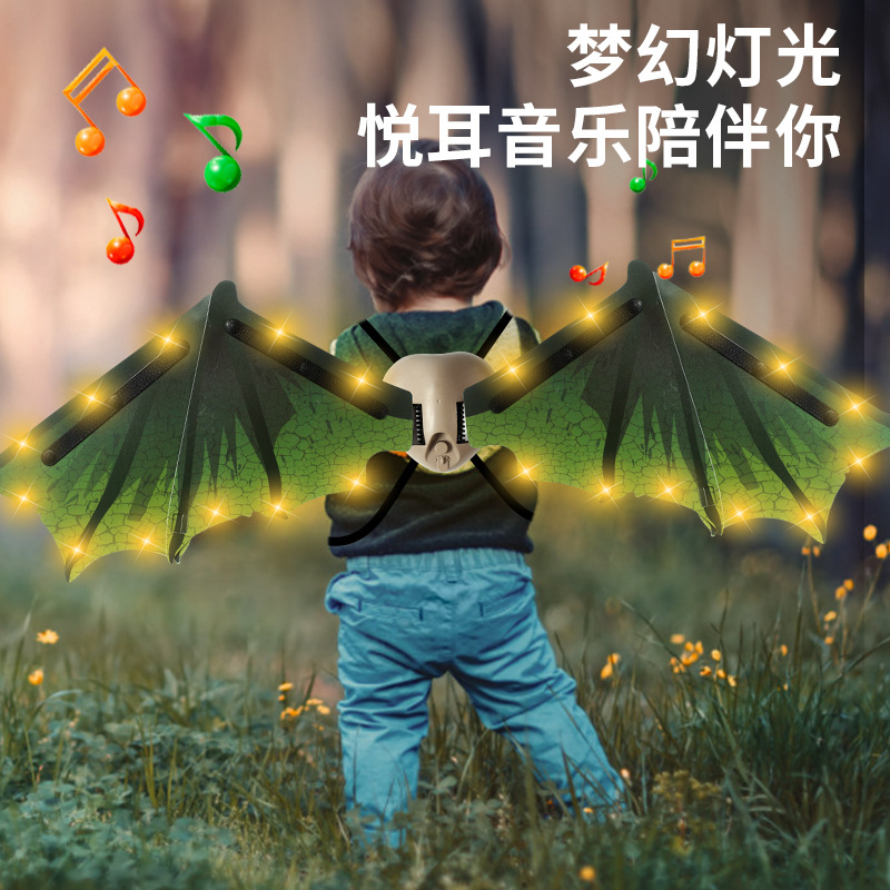 Alas de dinosaurio eléctrico para niños transfronterizos alas de elfo niños y niñas Halloween Navidad juguete luminoso decoración de la espalda