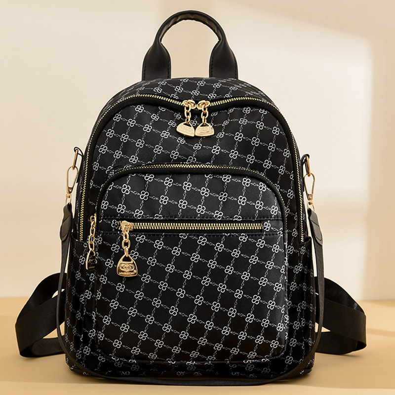 Mochila transfronteriza para mujer 2024 nueva moda color de contraste para mujer mochila de cuero suave para salida de gran capacidad mochila pequeña de tres fines