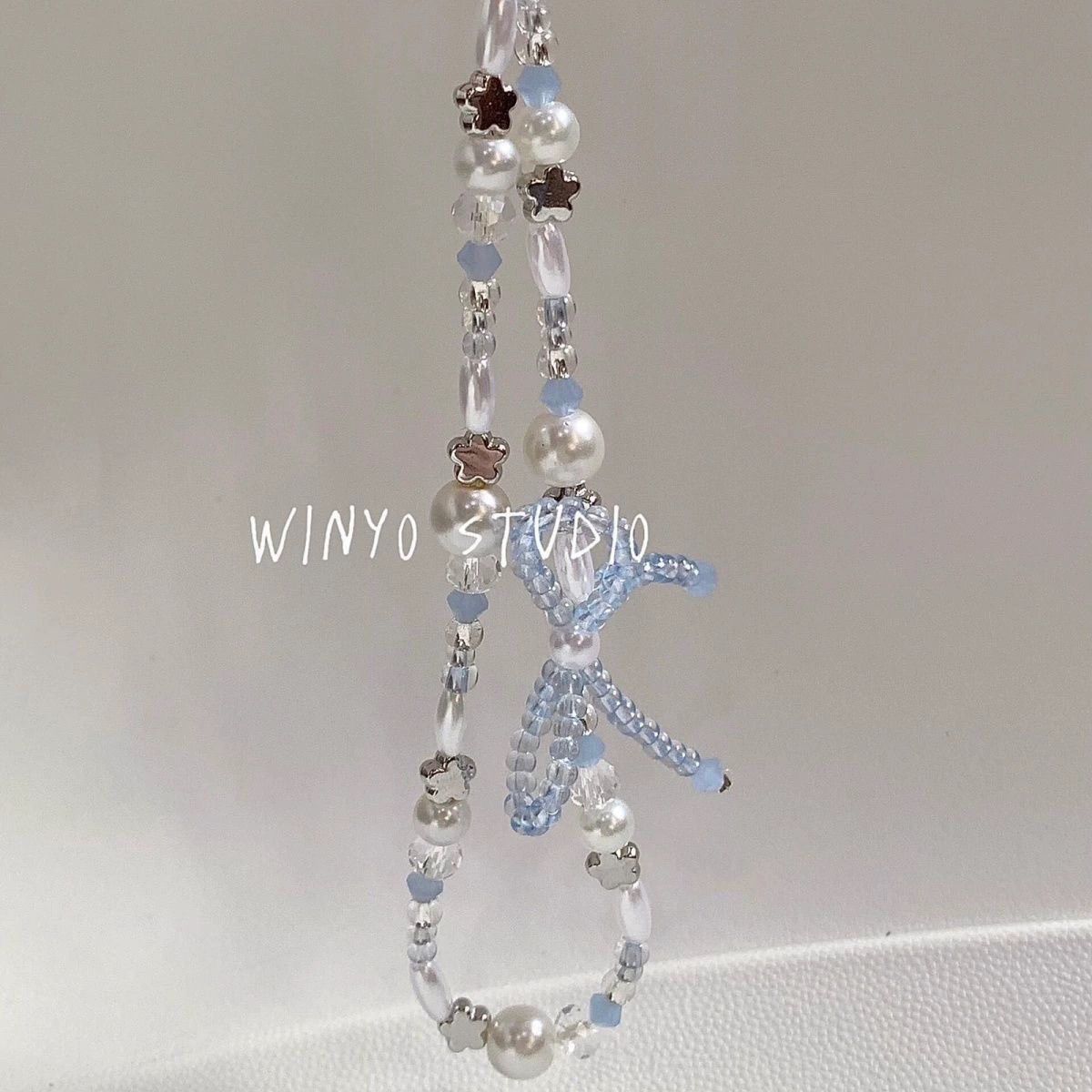 Instagram-style beaded bow phone lanyard, CCD beaded camera charm chain, fresh floral design.