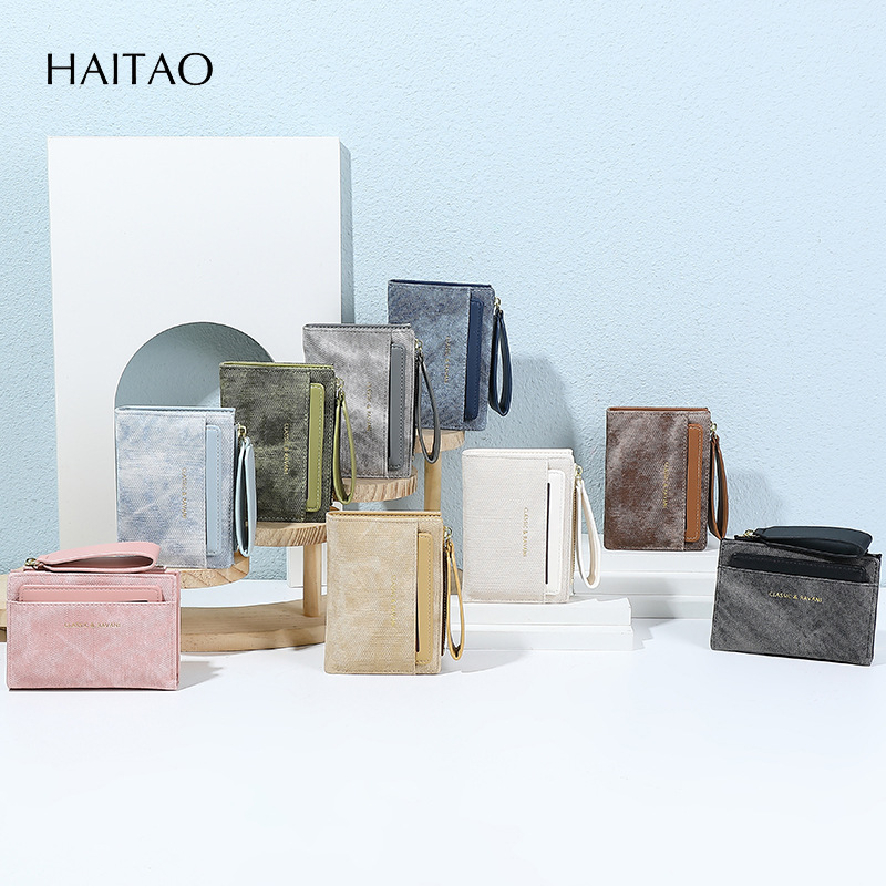 Nueva billetera de mujer corta bolsa de tarjetas de color sólido2025 mujeres de alto nivel sentido transfronterizo cremallera fuente de bolso de cambio fabricantes