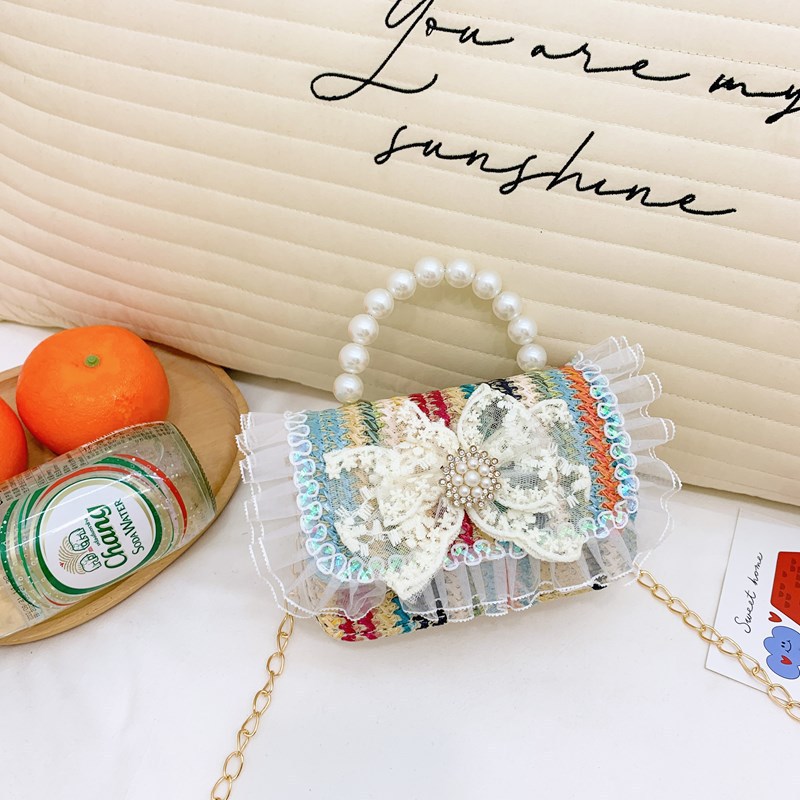 2025 nuevo regalo para niñas para niñas jardín de infantes Día de los niños arco de perla tela de paja bolso de hombro
