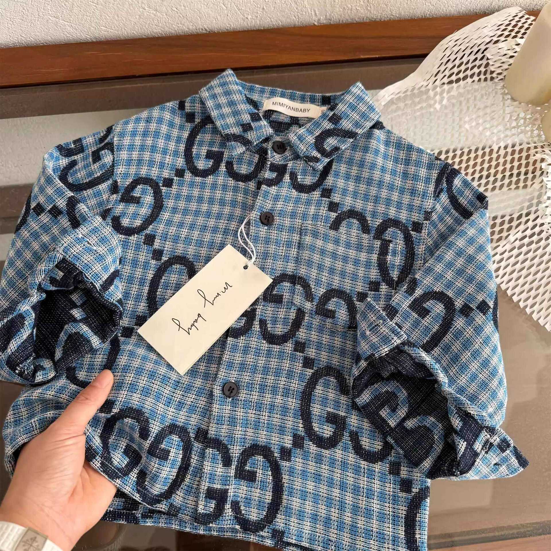 Camisas de mangas largas para niños de estrellas redondas de primavera 2025 camisas de moda de moda para niños y niñas bebés de impresión completa chaqueta a cuadros