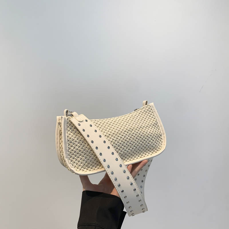 Bolsa trenzada debajo de la axila damas 2024 nuevo estilo ligero de lujo nicho de alta sensación de verano de vacaciones en la playa pastoral bolsa de paja