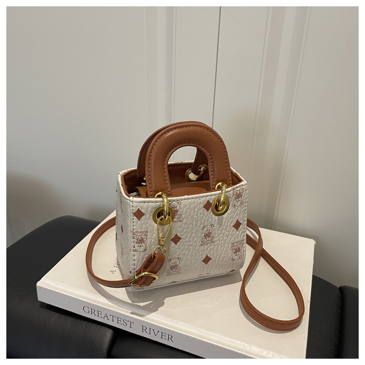2026 nuevo bolso infantil caricatura lindo oso impresión bolso de hombro de moda mini bolso de bebé