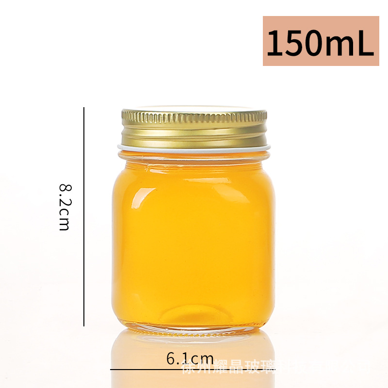 Botella de vidrio redonda de grado alimenticio, botella enlatada transparente sellada, botella de salsa de chile vacía, botella de miel con tapa para cocinar