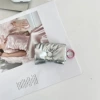 With bow, silver