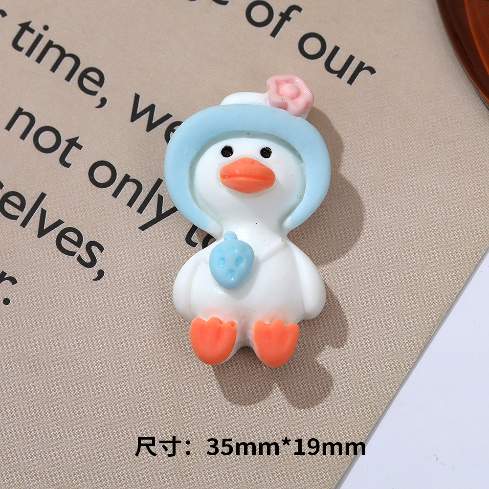 Sombrero de paja al por mayor de pato de celebridad de Internet de dibujos animados de cabeza torcida DIY accesorios de resina teléfono móvil Shell accesorios para el cabello agujero hebilla de zapato