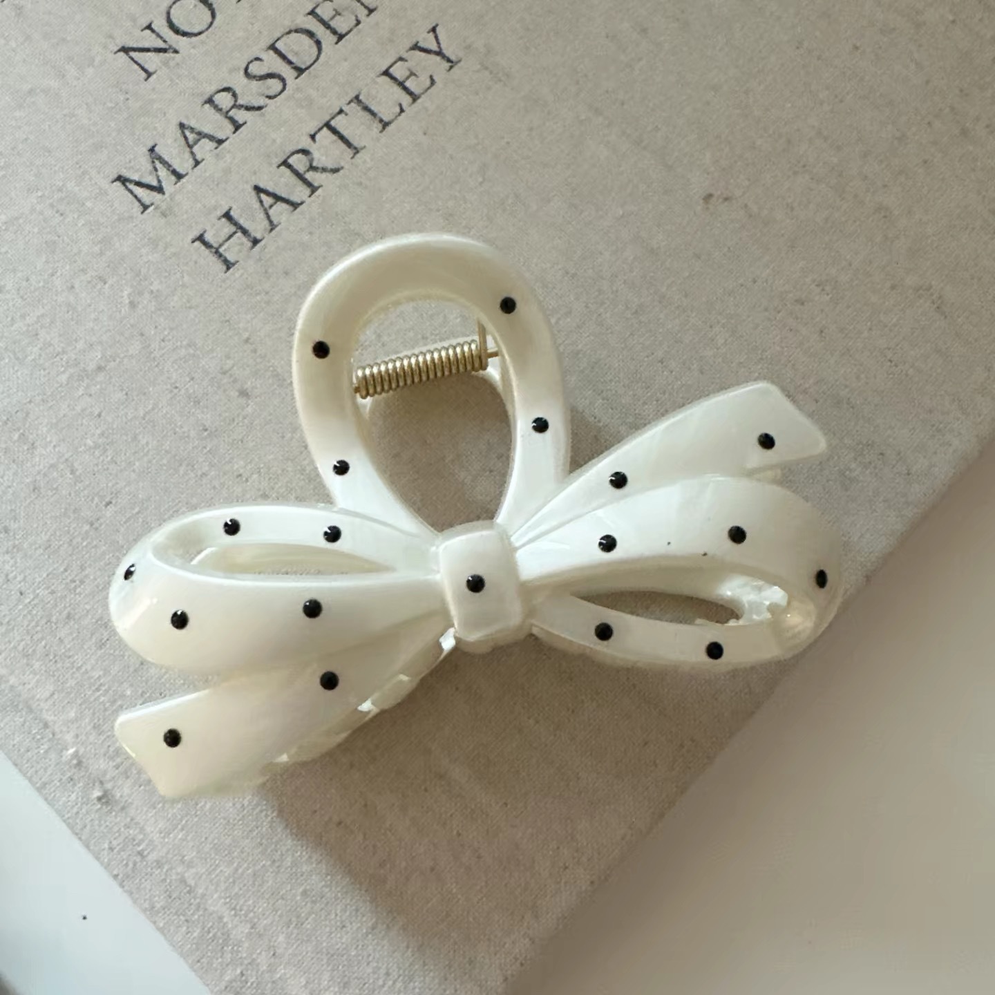 White polka dot hollow bow