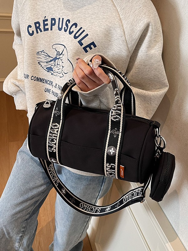 Oxford tela de contraste de color ligero bolso cilíndrico de mano casual para mujeres 2025 nuevo alto valor ocio transporte de viaje mochila
