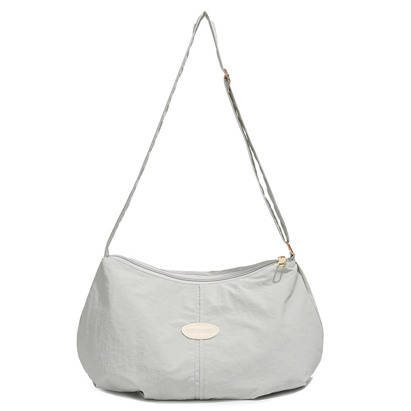 Bolso de color sólido universal 2025, nuevo bolso de bolsas de bolsas de bolsas de moda de hombro, mochila de viaje casual para hombres y mujeres.