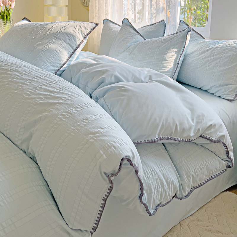 Cama de algodón lavado cepillada simple de cuatro piezas Four Seasons 2025 nueva sábana funda de edredón sábana ropa de cama de dormitorio