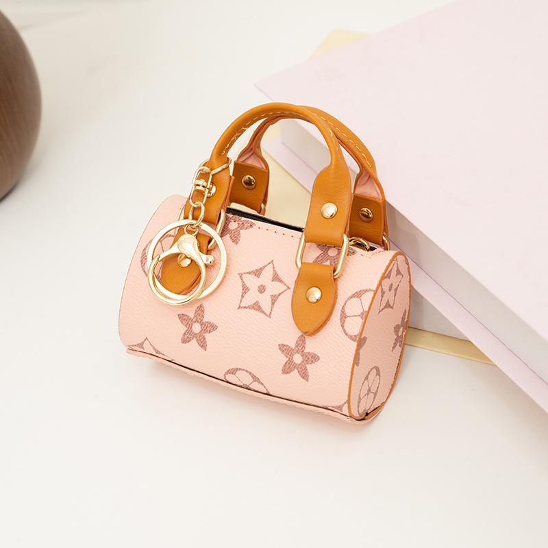 Cross-border pillow bag, 2026 Spring/Summer new style, lipstick handbag, retro monogram keychain bag, dropshipping available.