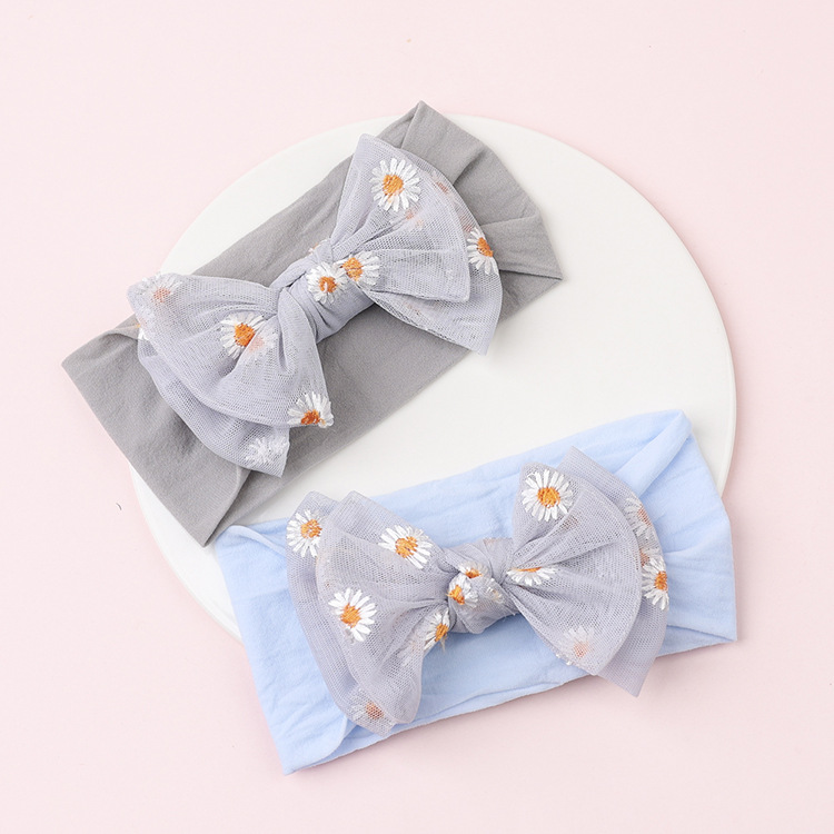 Simple Solid Color Double Bow Children Small Daisy Flower Nylon Headband display picture 1