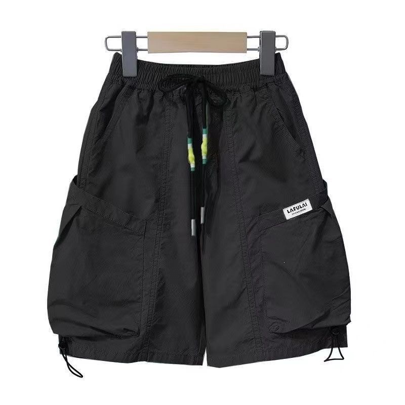 Children's quick-drying shorts, summer thin style, 2026 new style, for medium and large children, sporty, casual, loose and handsome, trendy boys' shorts.