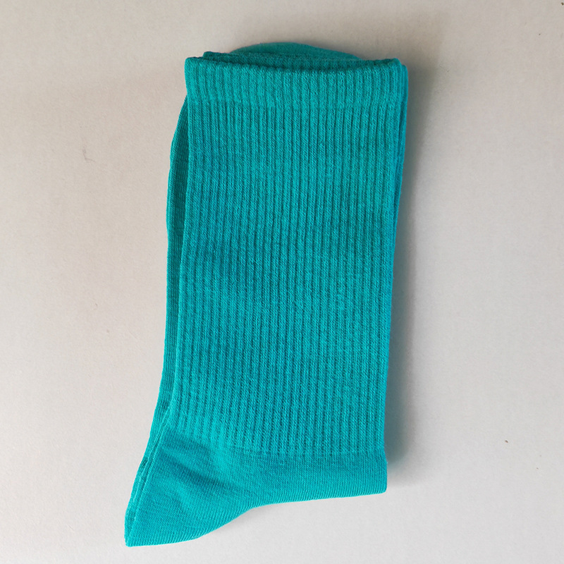 Calcetines de mujer para primavera y otoño, calcetines de algodón de color liso, versátiles y a la moda, calcetines holgados, calcetines de longitud media, calcetines deportivos que absorben el sudor, venta al por mayor.