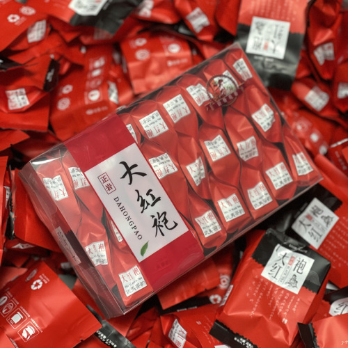 Tieguanyin tea, Anxi Da Hong Pao, Jin Jun Mei, and Xiao Zhong in a PC box, packaged as a viral high mountain black tea, shipped individually.