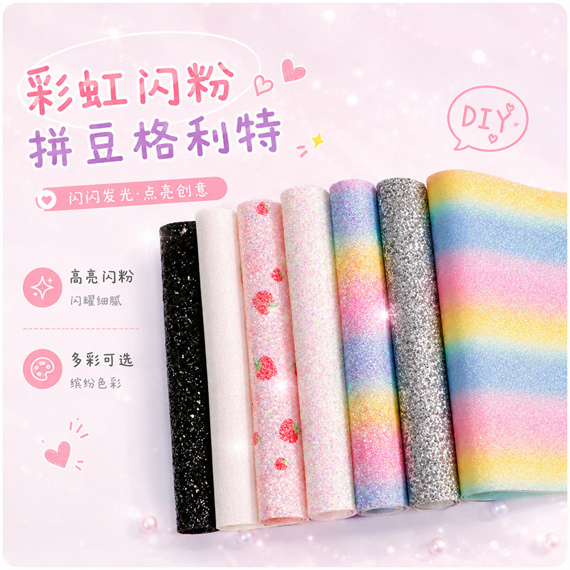 Glitter fabric with rainbow gradient, suitable for DIY crafts, featuring iridescent beads and heat-activated glitter Glitter fabric with rainbow gradient, suitable for DIY crafts, featuring iridescent beads and heat-activated glitter