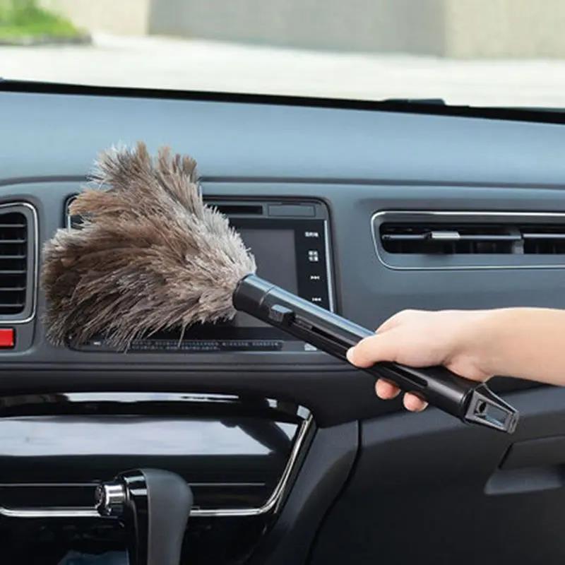 Black plastic retractable ostrich feather [expands about 40cm]