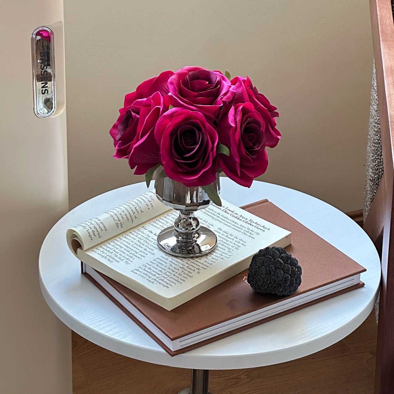 Pleated bottle + hand holding rose red