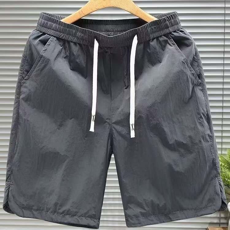 Nuevos pantalones de tendencia de cinco puntos para hombres comercio exterior transfronterizo de verano pantalones de playa para hombres pantalones cortos deportivos de cinco puntos para hombres pantalones de tendencia