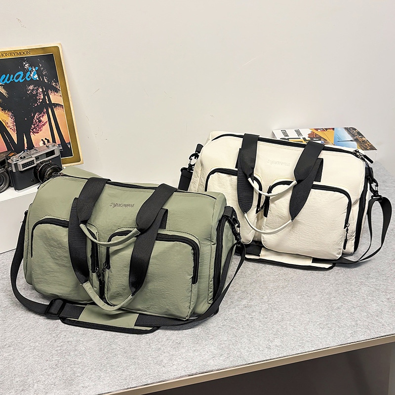 Bolsa deportiva de acondicionamiento físico de gran capacidad para mujeres bolsas de viaje corto bolsas de mano 2025 nuevas bolsas domésticas almacenables