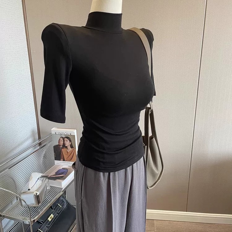 The fit is amazing! This women's slim-fit T-shirt features a half-high collar, padded shoulders, mid-length sleeves, and a stand-up collar design. It's a stretchy inner layer perfect for layering