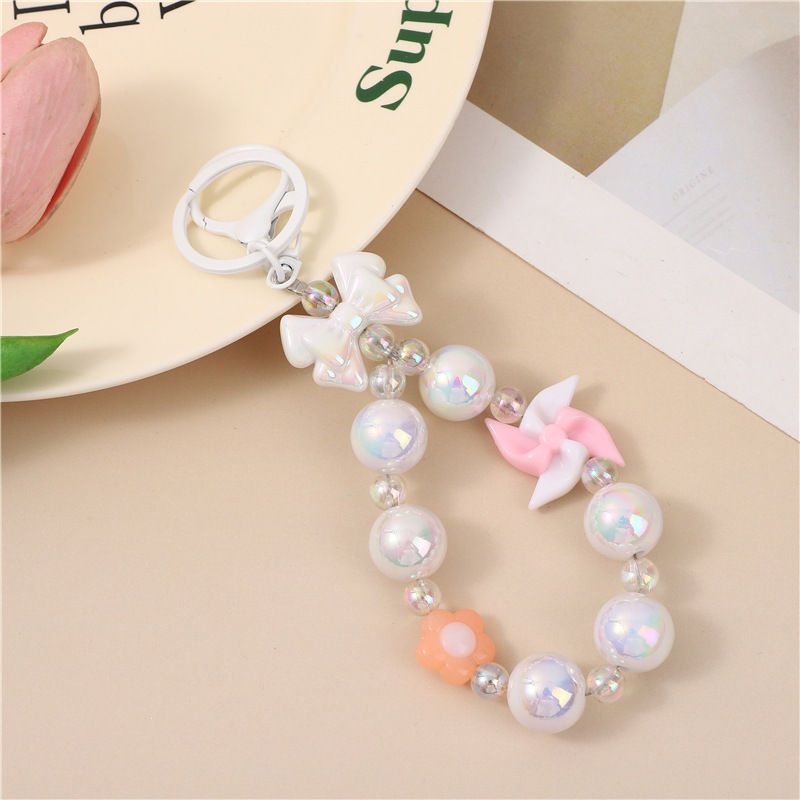 Japón y Corea del Sur color ins hecho a mano con cuentas flor llavero cordón de muñeca macaron color pétalo cordón de teléfono móvil en stock