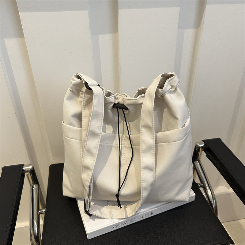 Bolsa de ocio para mujeres 2024 nuevo bolso de tela de verano, bolso de hombro de gran capacidad, bolso de clase, mochila de viaje