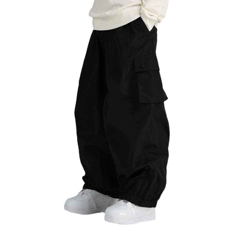 Pantalones de snowboard a prueba de viento impermeables sueltos de primavera y otoño pantalones de hombres y mujeres deportes al aire libre multi-Bolsillo casual pantalones atados al tobillo