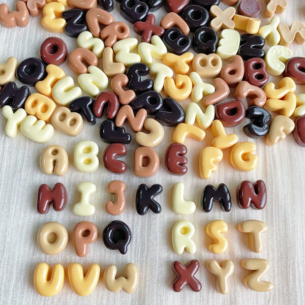 small brown accessories with letters