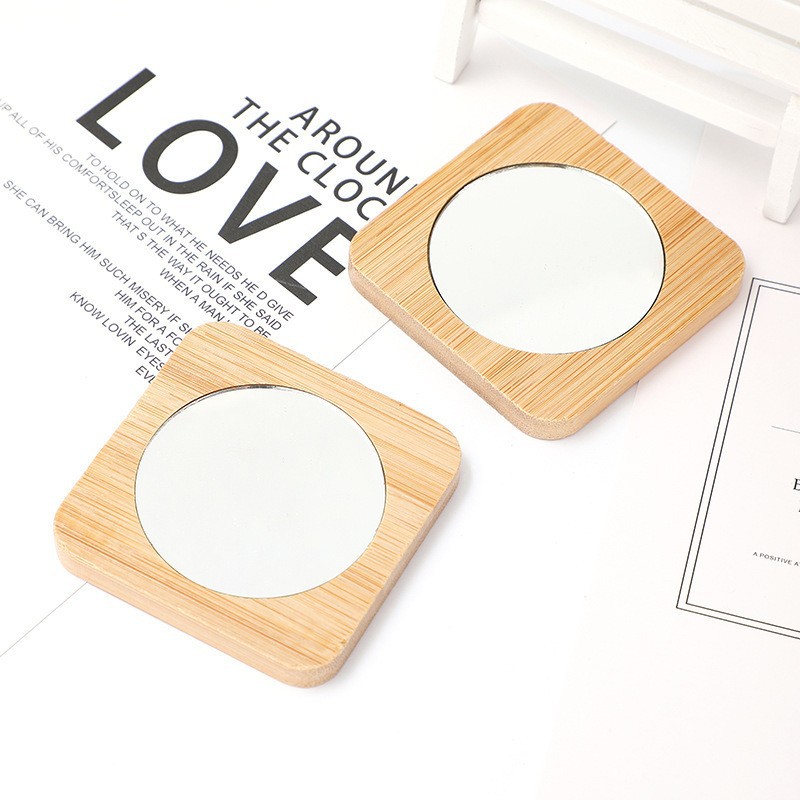 Fábrica de bambú al por mayor pequeño espejo circular de madera espejo mini espejo de maquillaje para dibujar logotipo de etiquetado personalizado