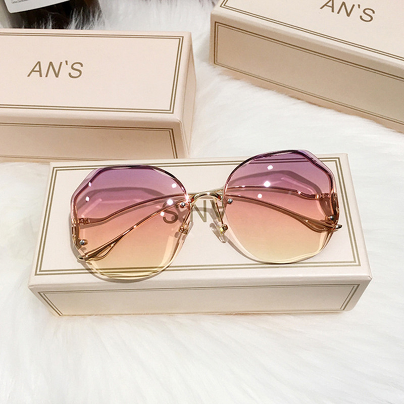 Gafas de sol sin montura grandes para mujer, patillas metálicas curvas, moda y protección UV, estilo de moda image 12