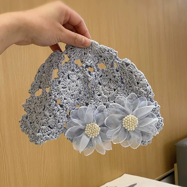 春夏の手編みの透かし彫りの帽子の女性のフックの花の民族の風のフリンジストラップカバーのニットの帽子